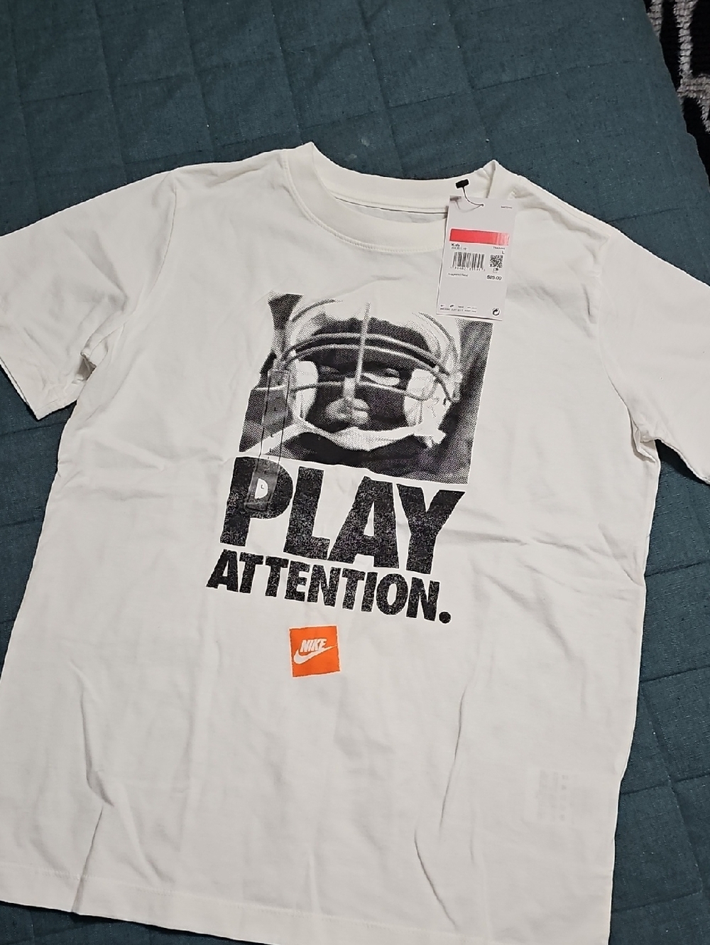 Nike White Graphic 'PLAY ATTENTION' Tee with Orange Logo